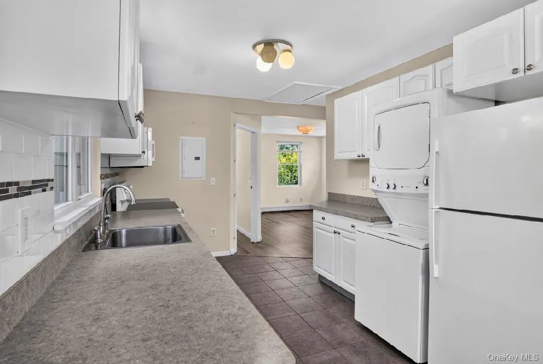 Kitchen featuring stackable W/D. Kitchen featuring stackable W/D.