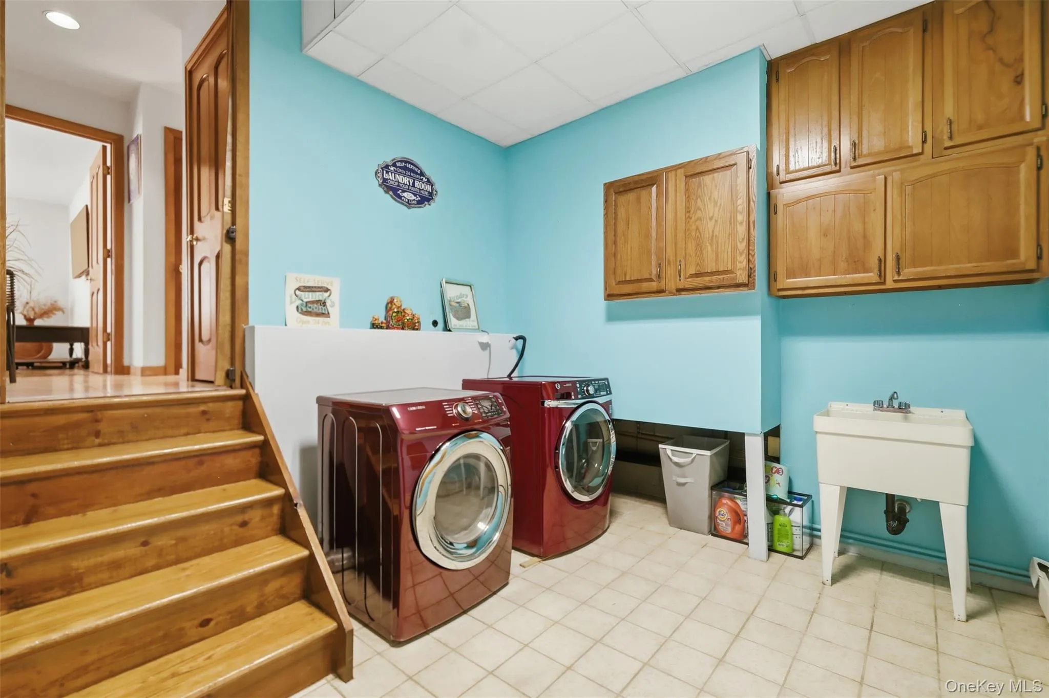 Dedicated utility space with durable tile flooring Dedicated utility space with durable tile flooring