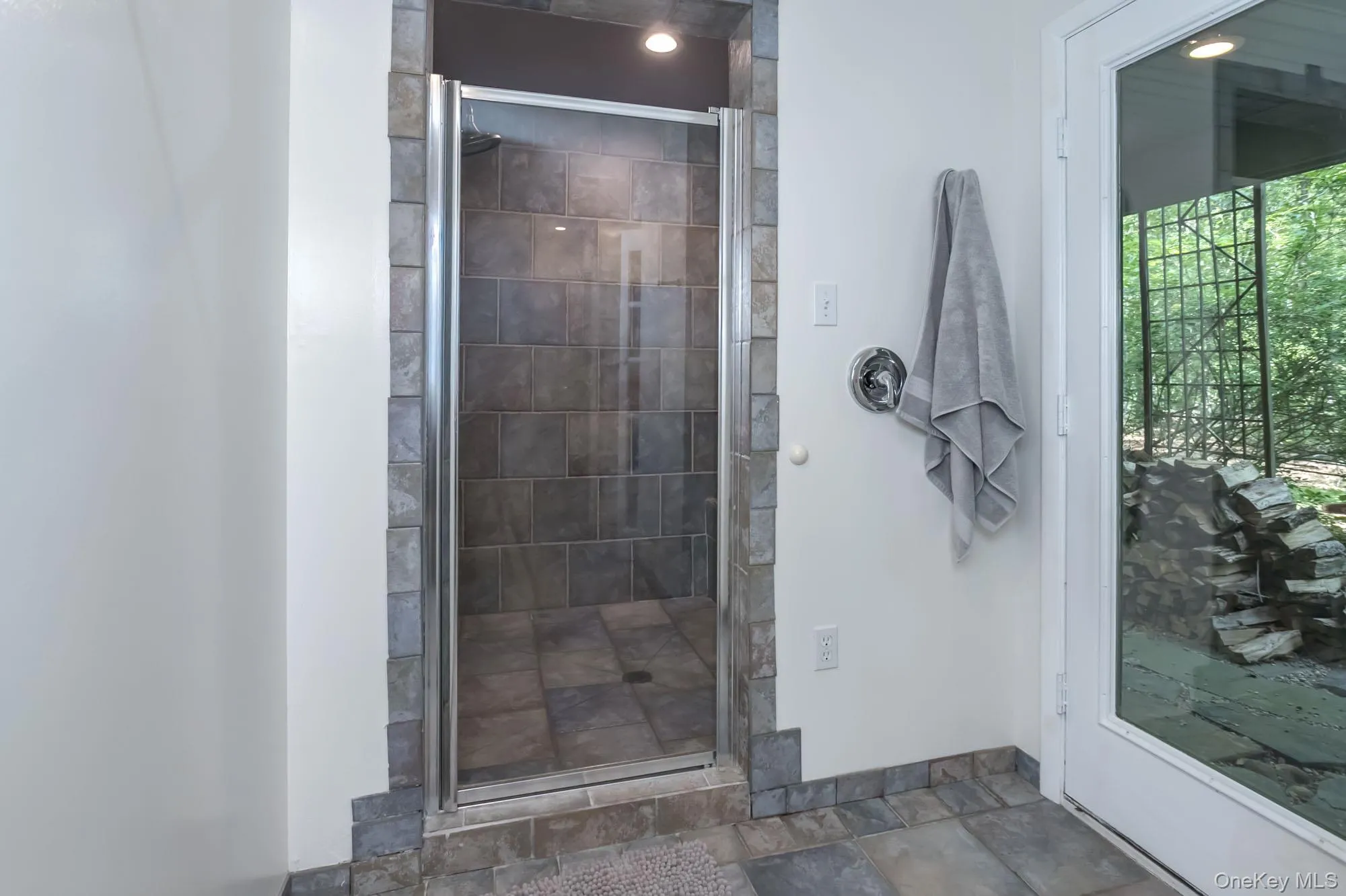 Walk in shower with access to outdoor shower Walk in shower with access to outdoor shower