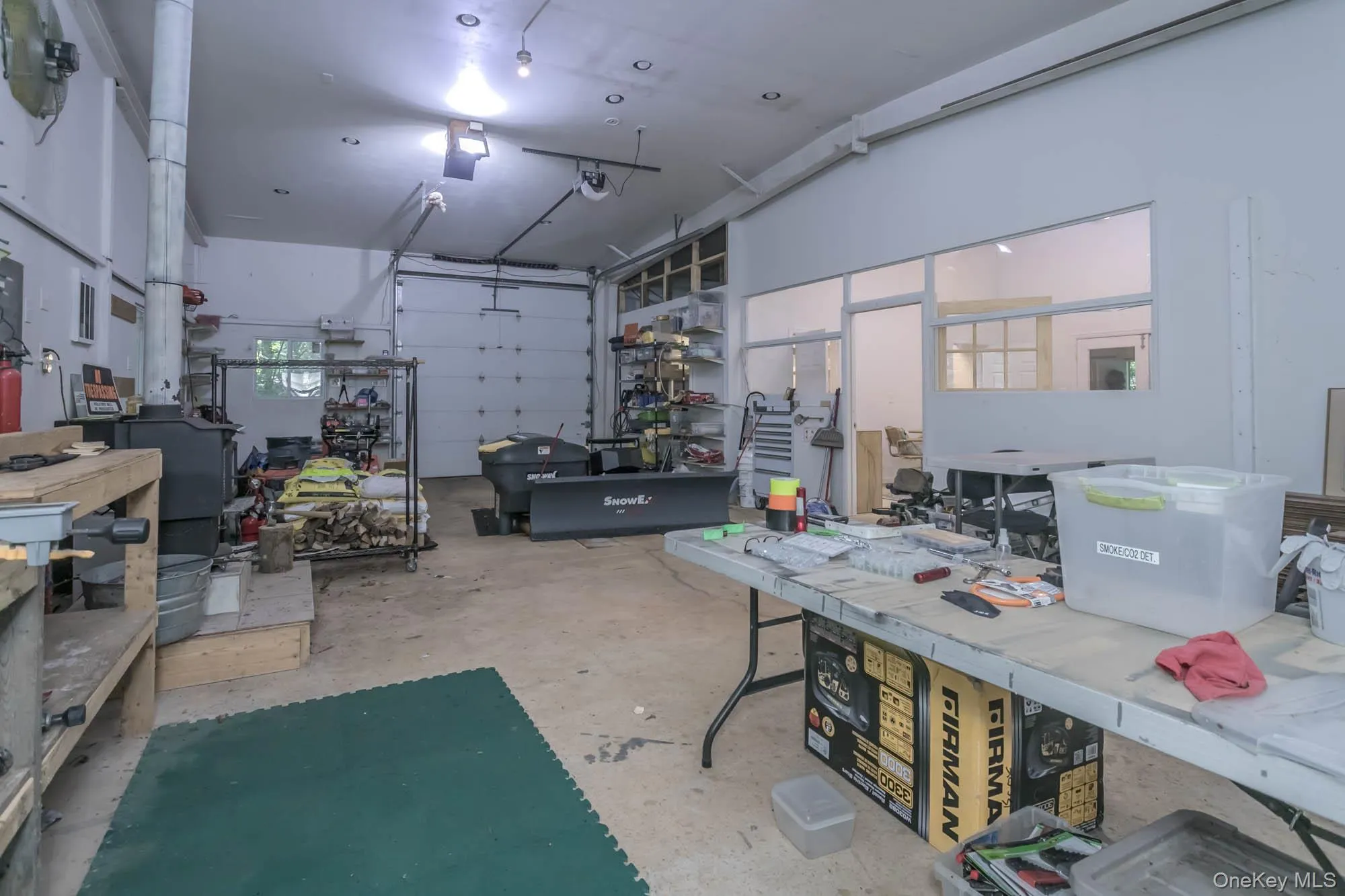 Rear shop space with wood burning stove Rear shop space with wood burning stove