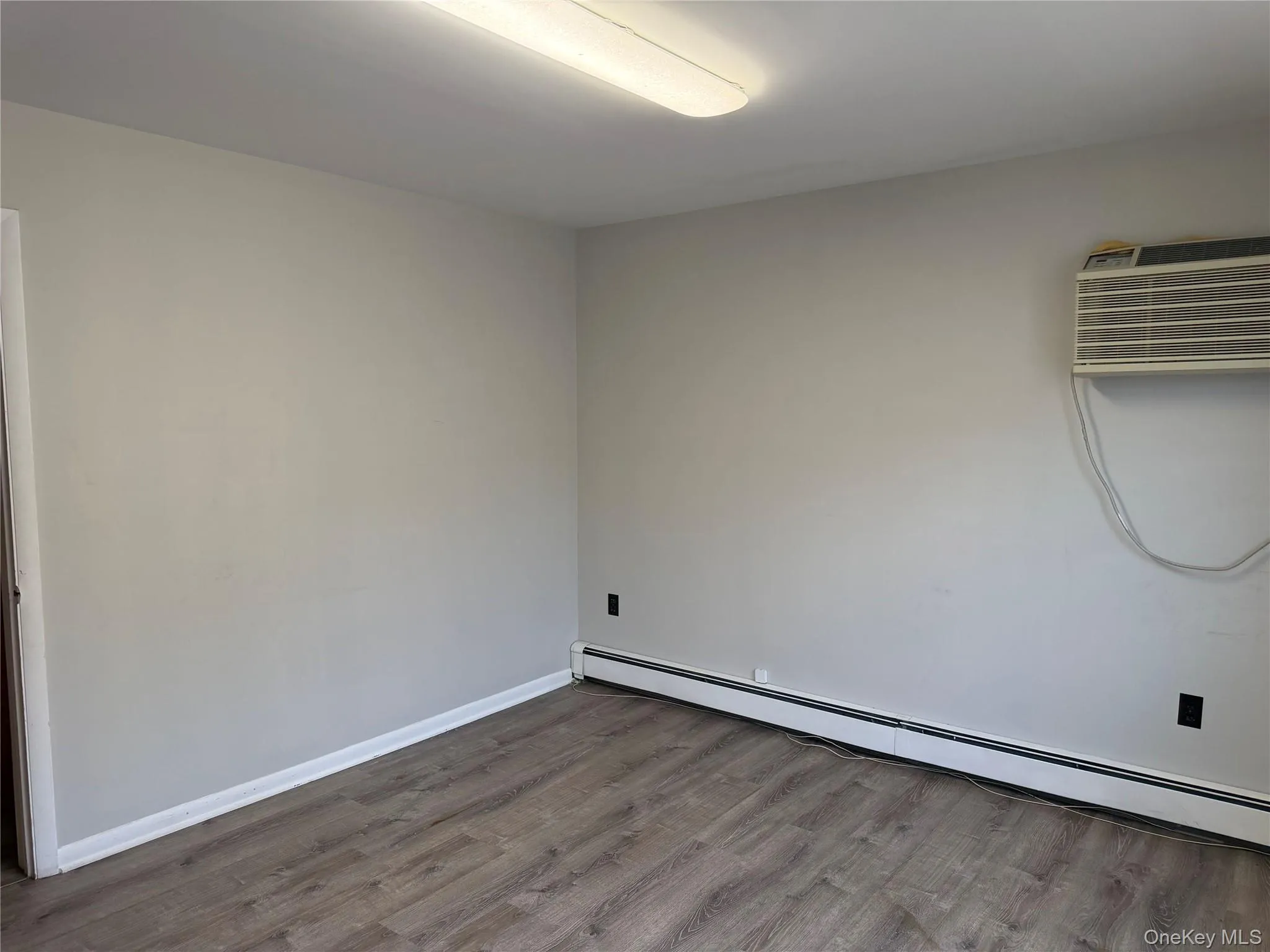 Private office with wood-finish flooring Private office with wood-finish flooring