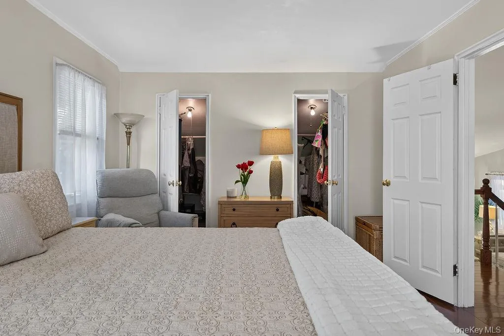 primary bedroom featuring 2 walk-in closets primary bedroom featuring 2 walk-in closets