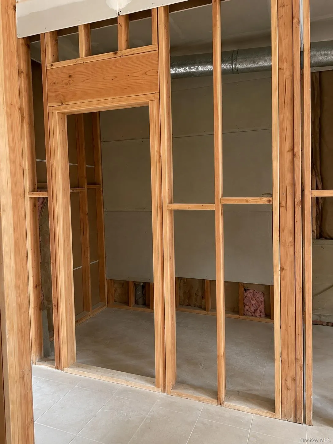 Interior with framing and tile floor Interior with framing and tile floor