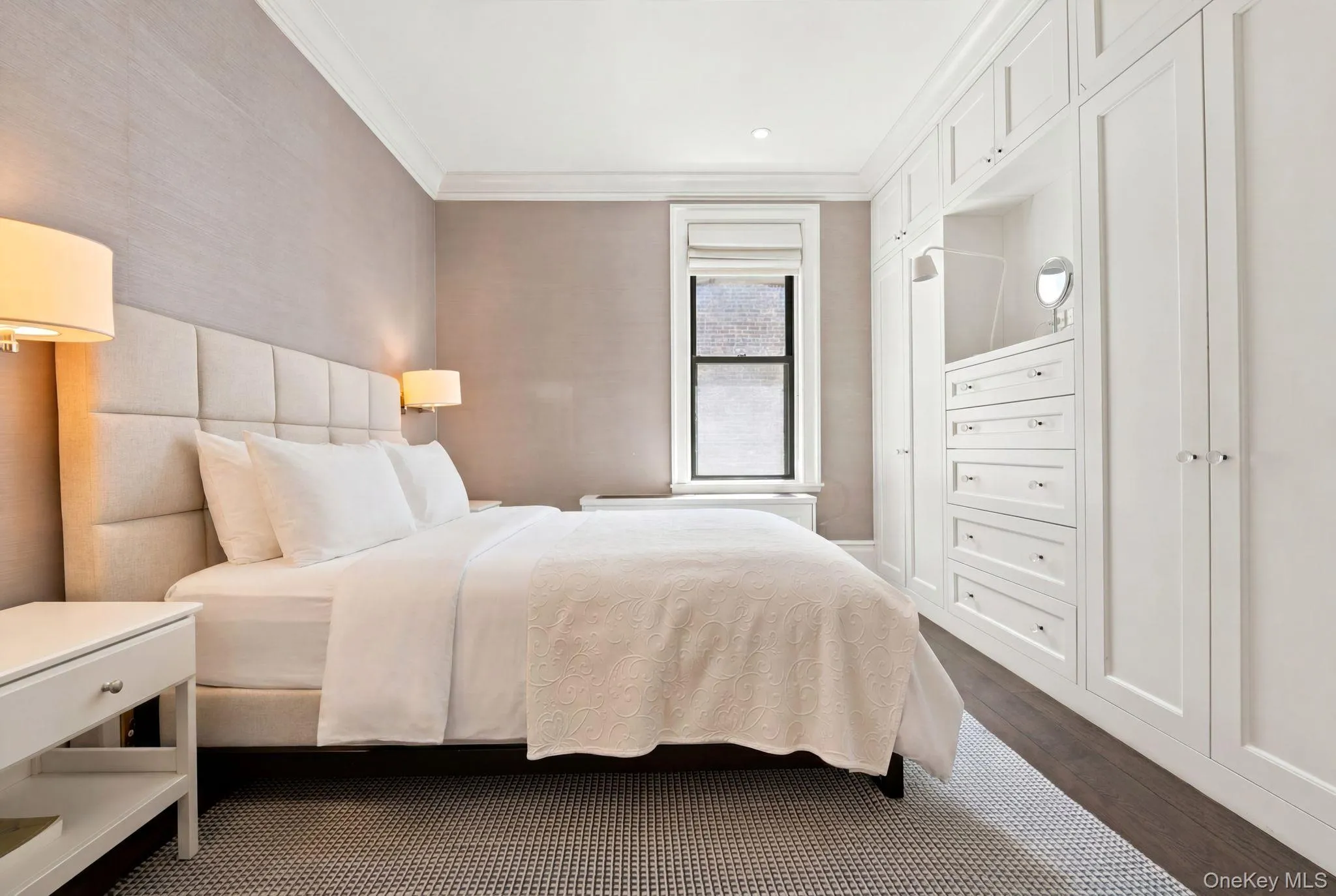Expansive built-in custom cabinetry with recessed lighting and drawer storage Expansive built-in custom cabinetry with recessed lighting and drawer storage