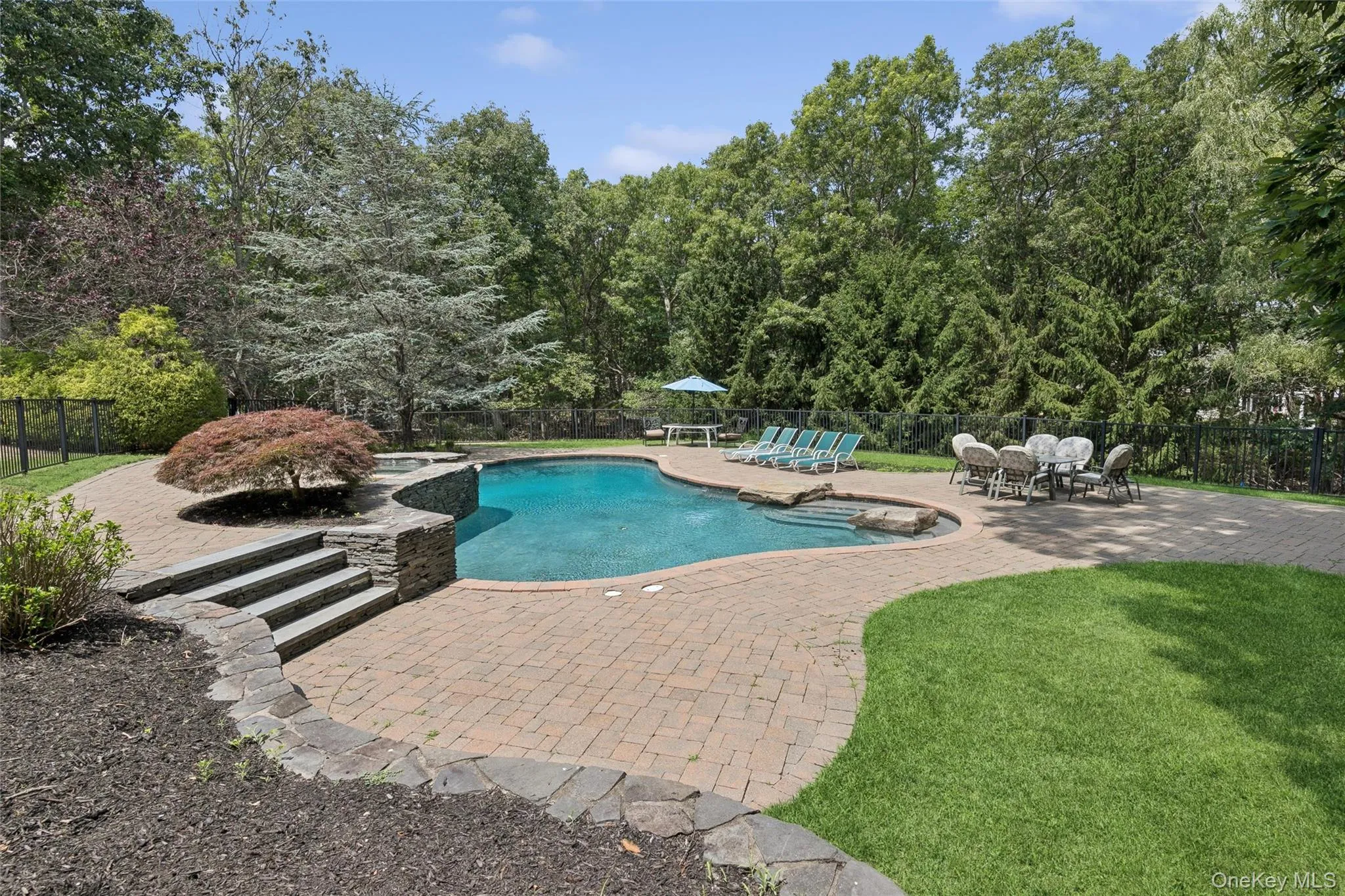 Free form gunite pool with spa Free form gunite pool with spa