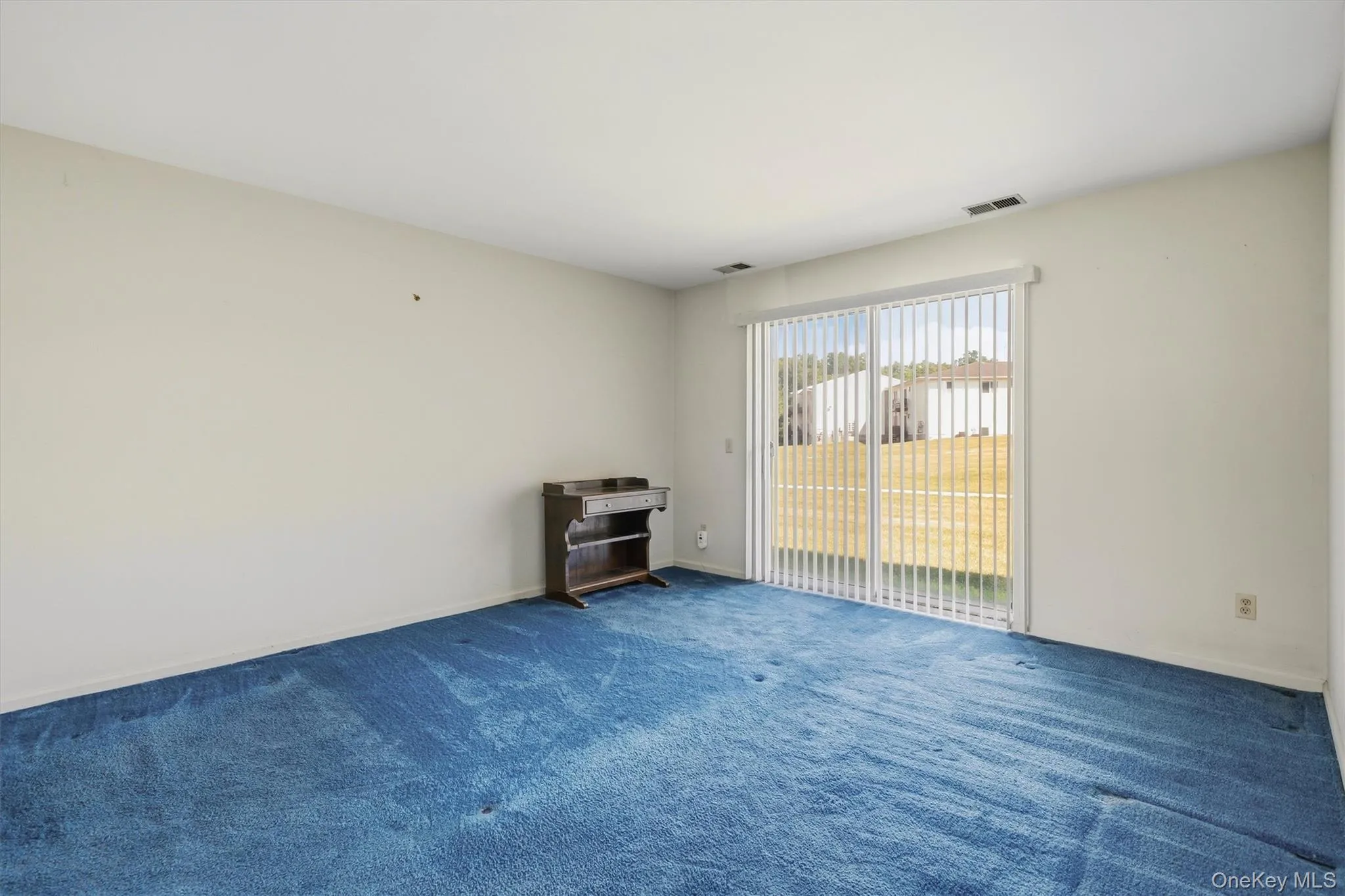Primary Bedroom with sliders to the courtyard Primary Bedroom with sliders to the courtyard