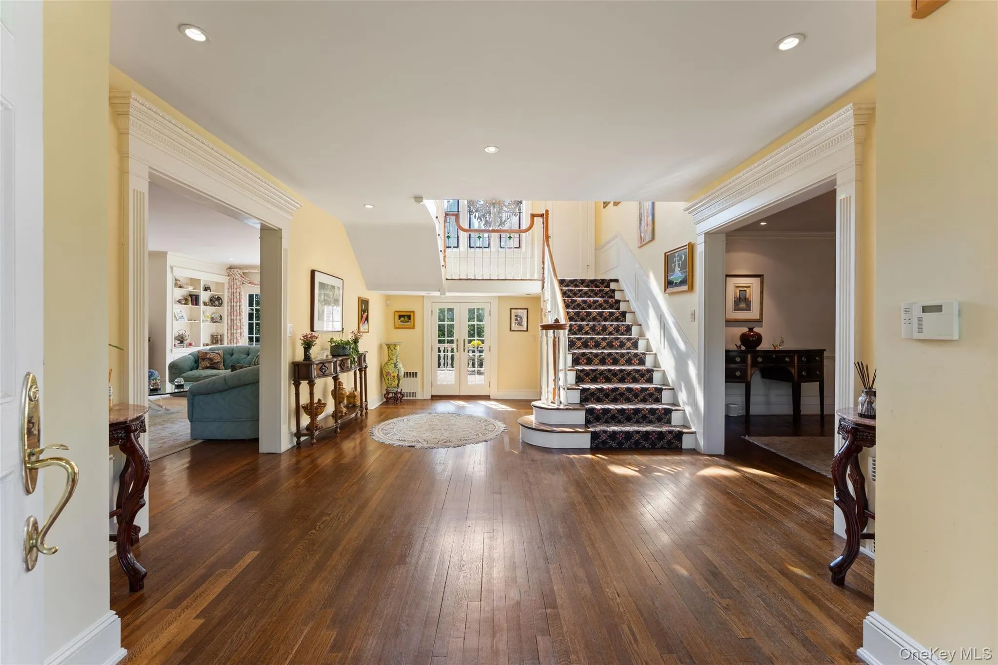 Grand entry foyer with gleaming hardwood floors Grand entry foyer with gleaming hardwood floors