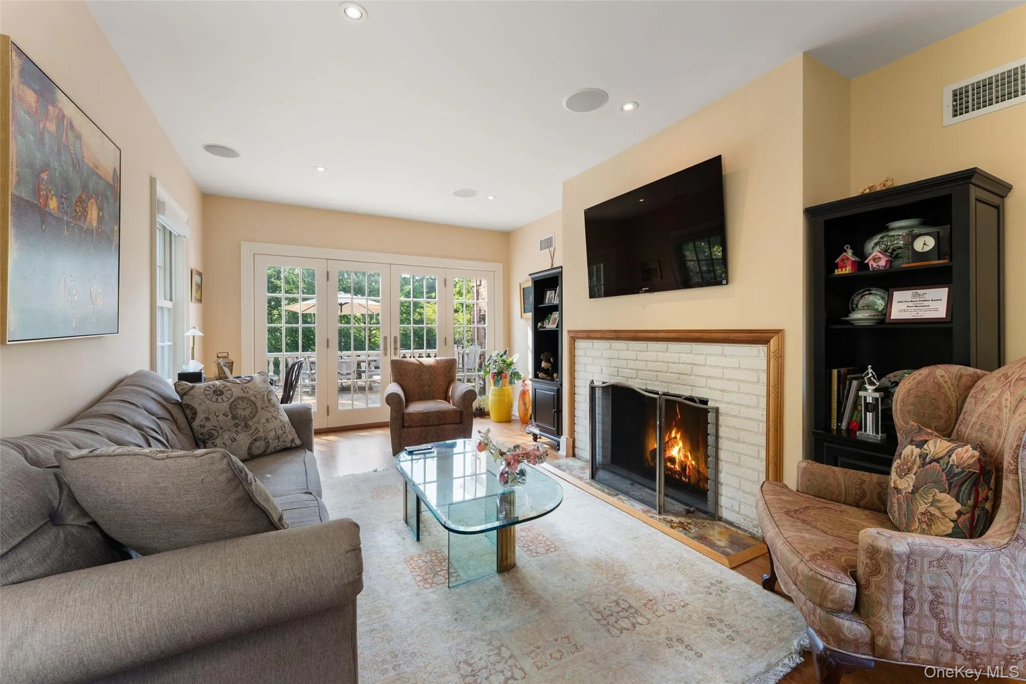 Library/office with french doors and wood burning fireplace Library/office with french doors and wood burning fireplace
