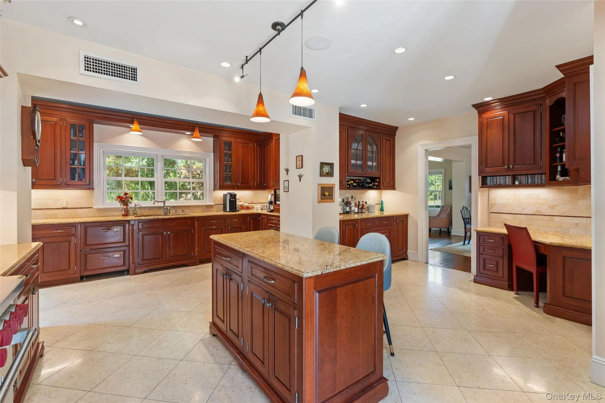 Gourmet kitchen with custom cabinetry with center island Gourmet kitchen with custom cabinetry with center island