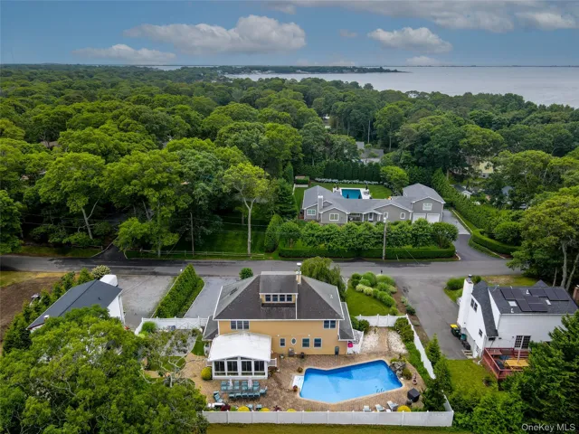 Aerial view of this turnkey Hamptons summer getaway!