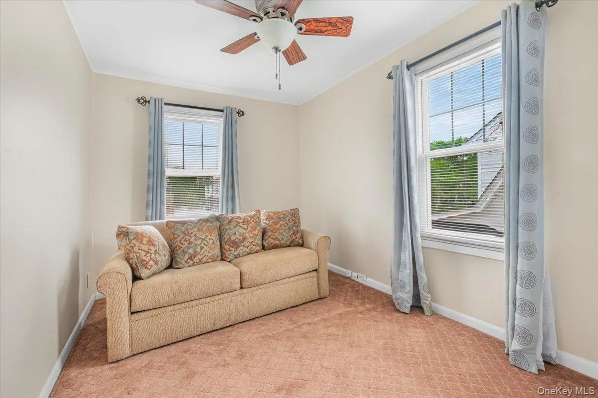 3rd Bedroom/Den with 2 windows, closet, carpeting. and a ceiling fan. 3rd Bedroom/Den with 2 windows, closet, carpeting. and a ceiling fan.