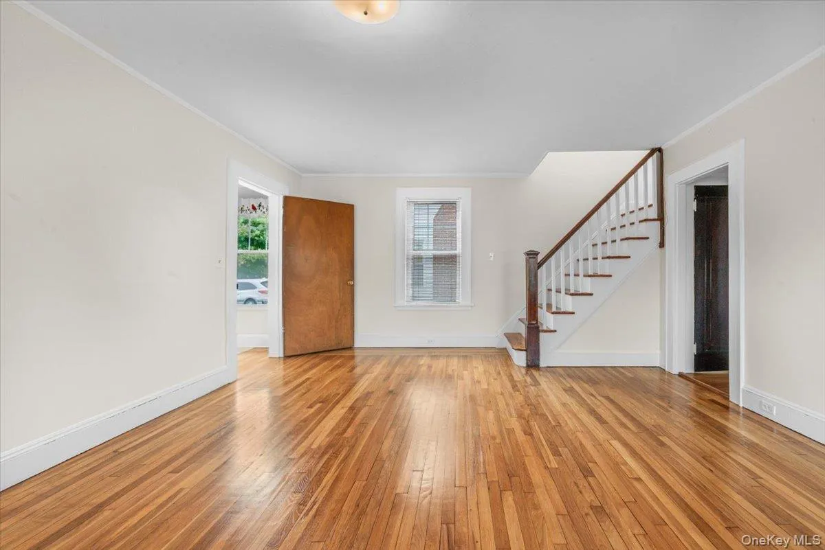 Spacious Living Room with original details and original staircase Spacious Living Room with original details and original staircase