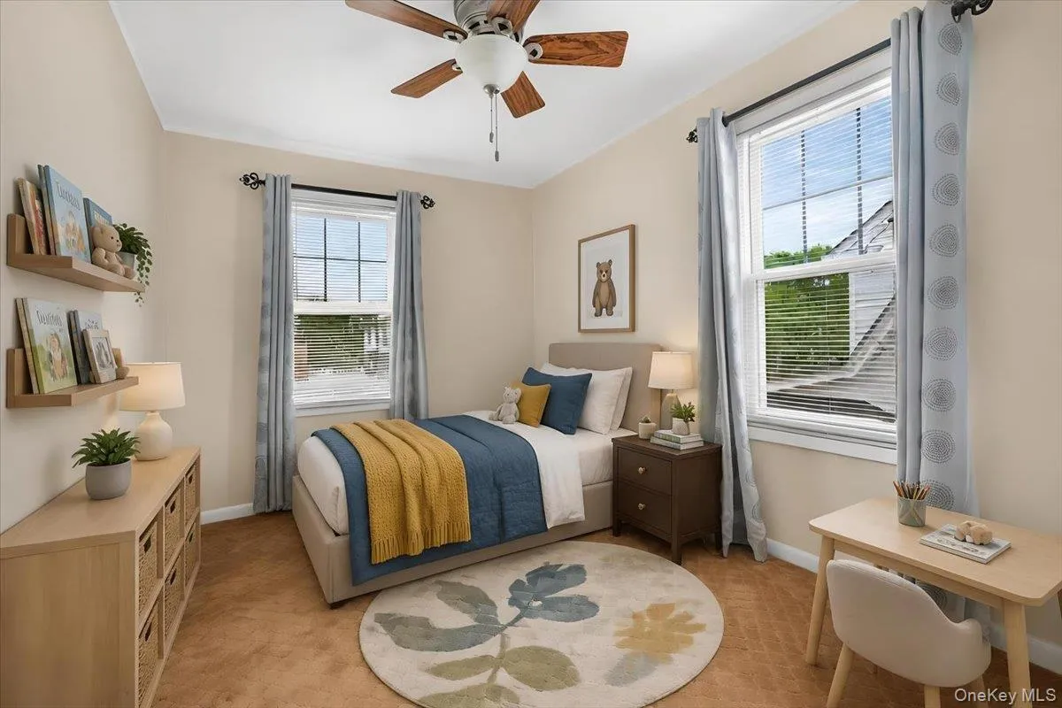 3rd Bedroom with 2 windows, closet, carpeting. and a ceiling fan. 3rd Bedroom with 2 windows, closet, carpeting. and a ceiling fan.