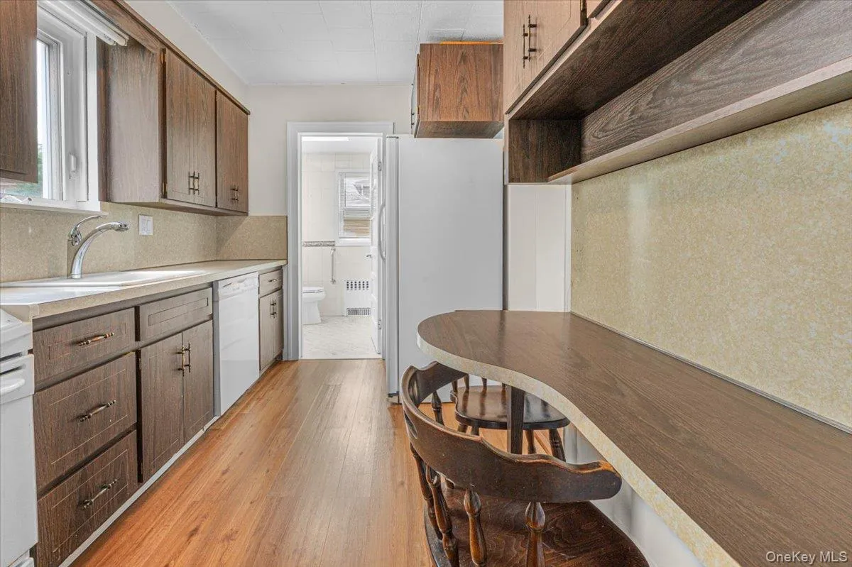 Eat-in-Kitchen with Dishwasher, Stove and double door Refrigerator. Window over the kitchen sink. Laminate flooring Eat-in-Kitchen with Dishwasher, Stove and double door Refrigerator. Window over the kitchen sink. Laminate flooring