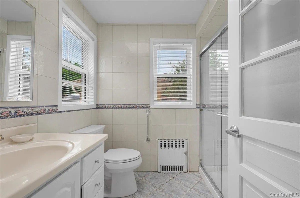 Convenient 1st floor full bathroom with walk in shower , 2 windows and a skylight. Convenient 1st floor full bathroom with walk in shower , 2 windows and a skylight.