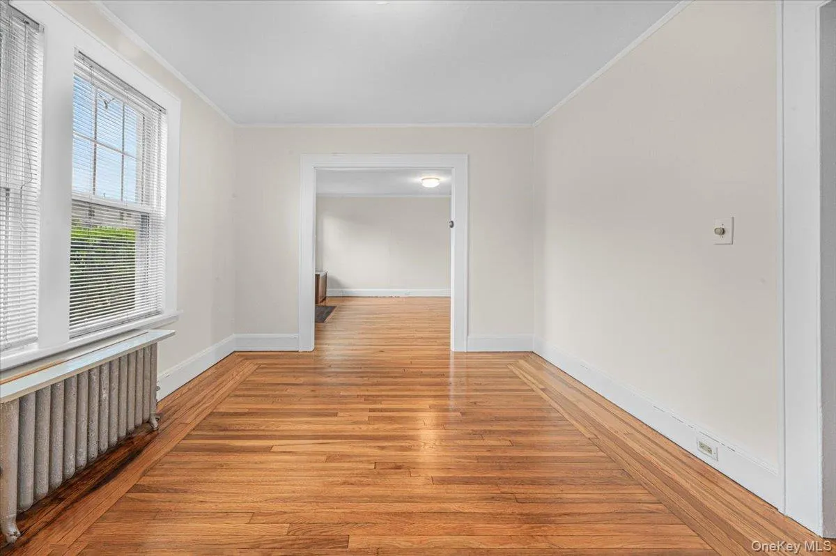 Formal Dining room with 2 large windows, hardwood flooring Formal Dining room with 2 large windows, hardwood flooring