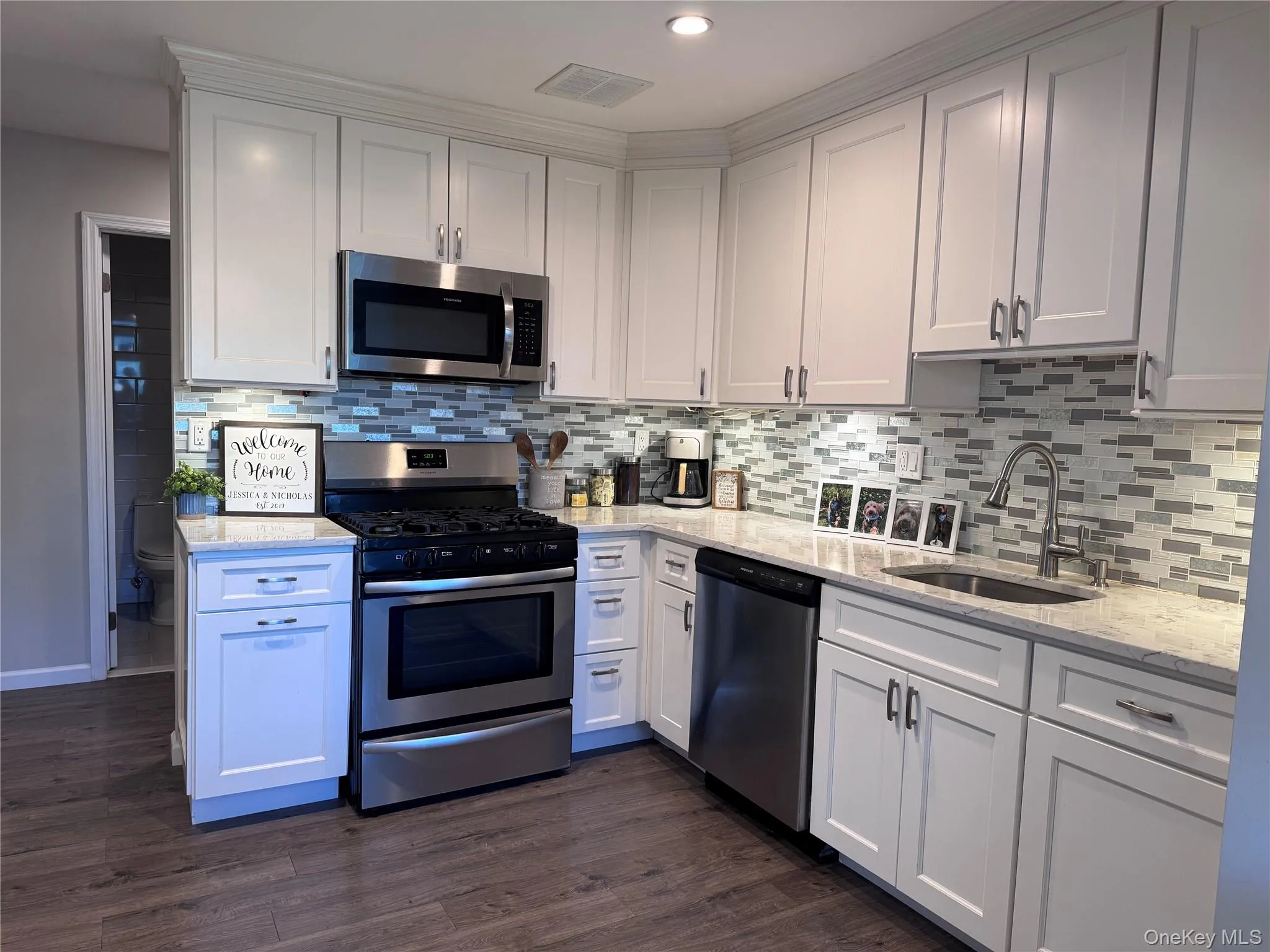 Gorgeous kitchen with quartz, Stainless appliances, soft close cabinetry, tile backsplash and undermount lighting. Gorgeous kitchen with quartz, Stainless appliances, soft close cabinetry, tile backsplash and undermount lighting.