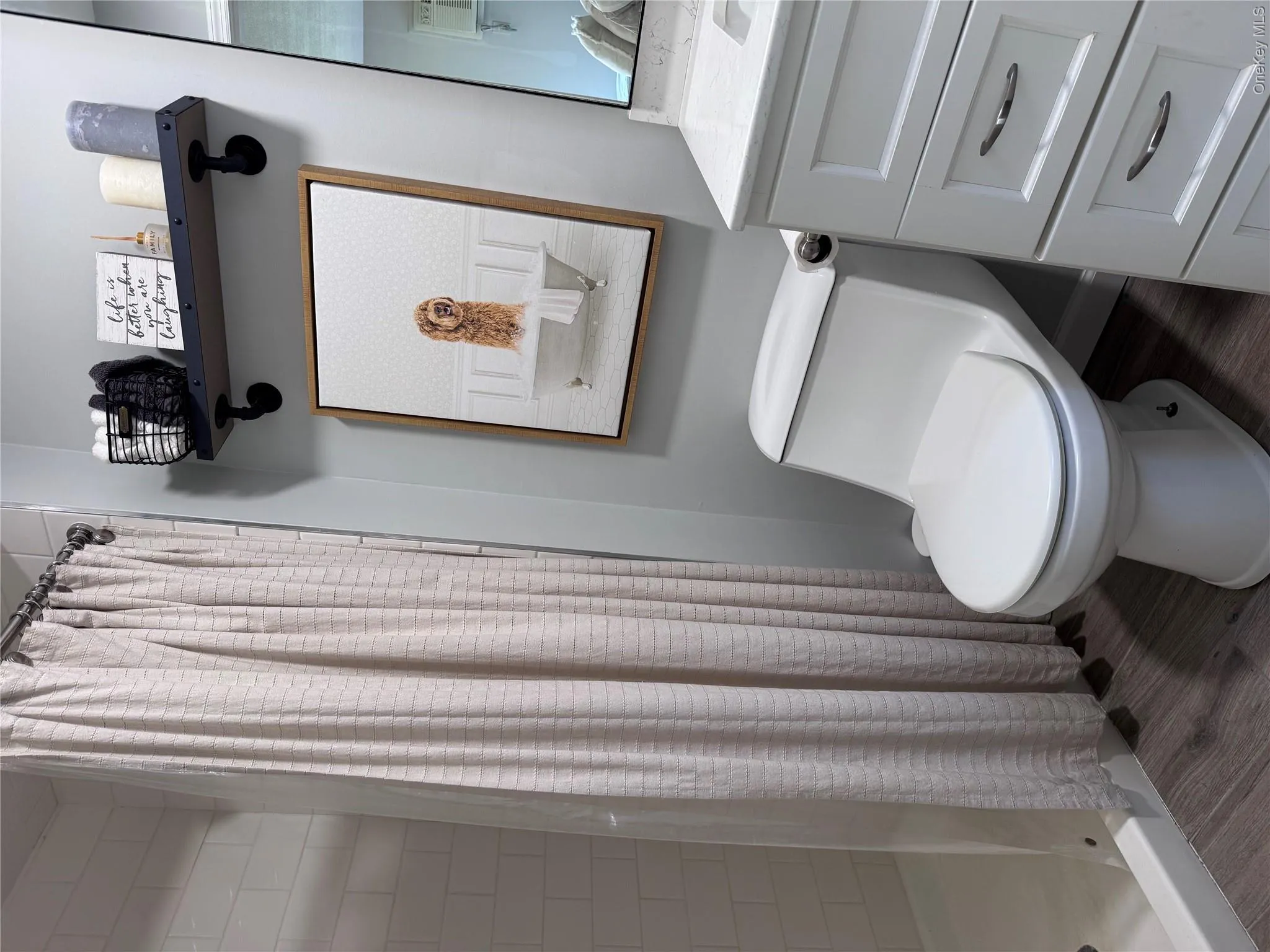 Ensuite bath features tiled shower. Ensuite bath features tiled shower.
