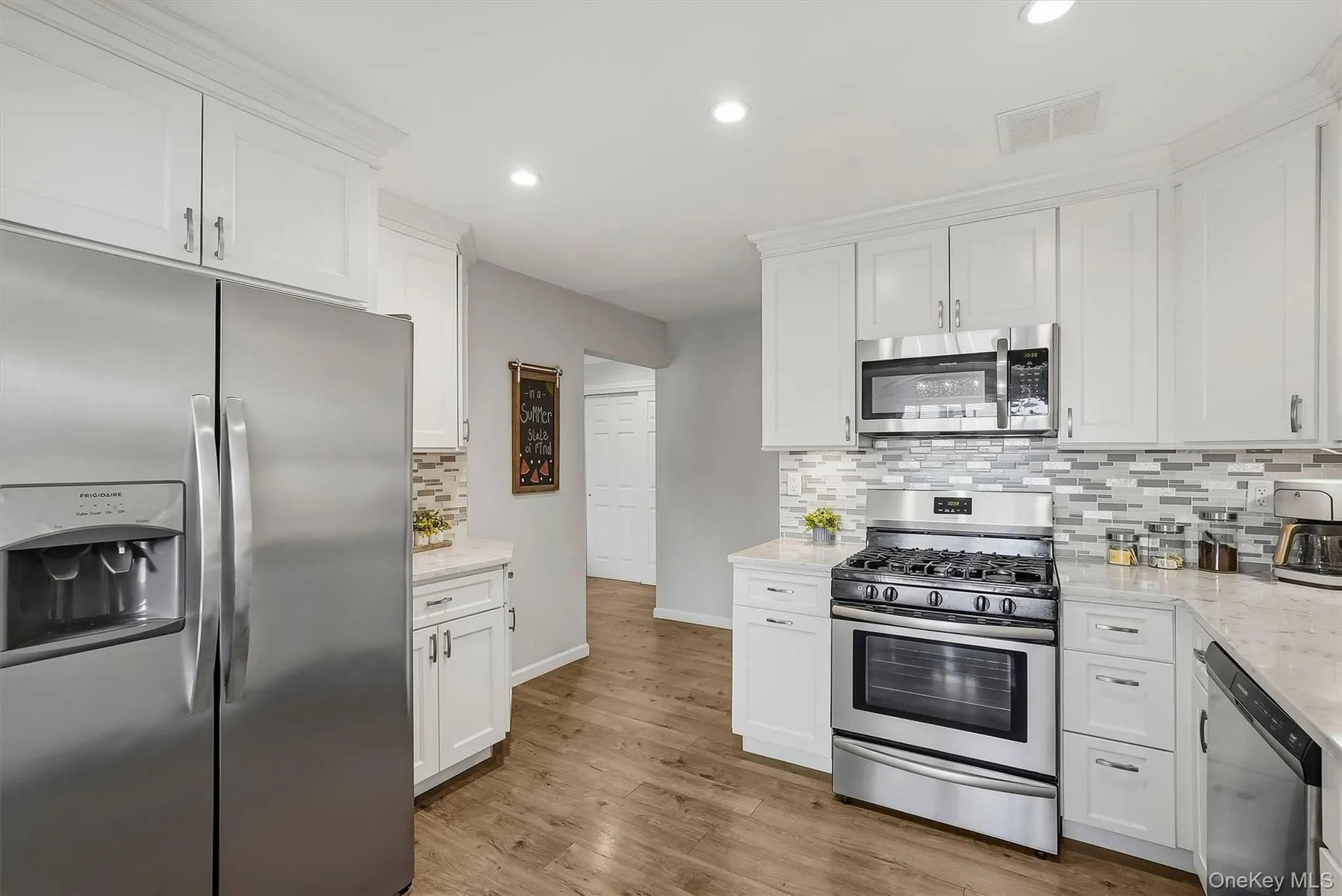 Kitchen with stainless and quartz counter tops. Kitchen with stainless and quartz counter tops.