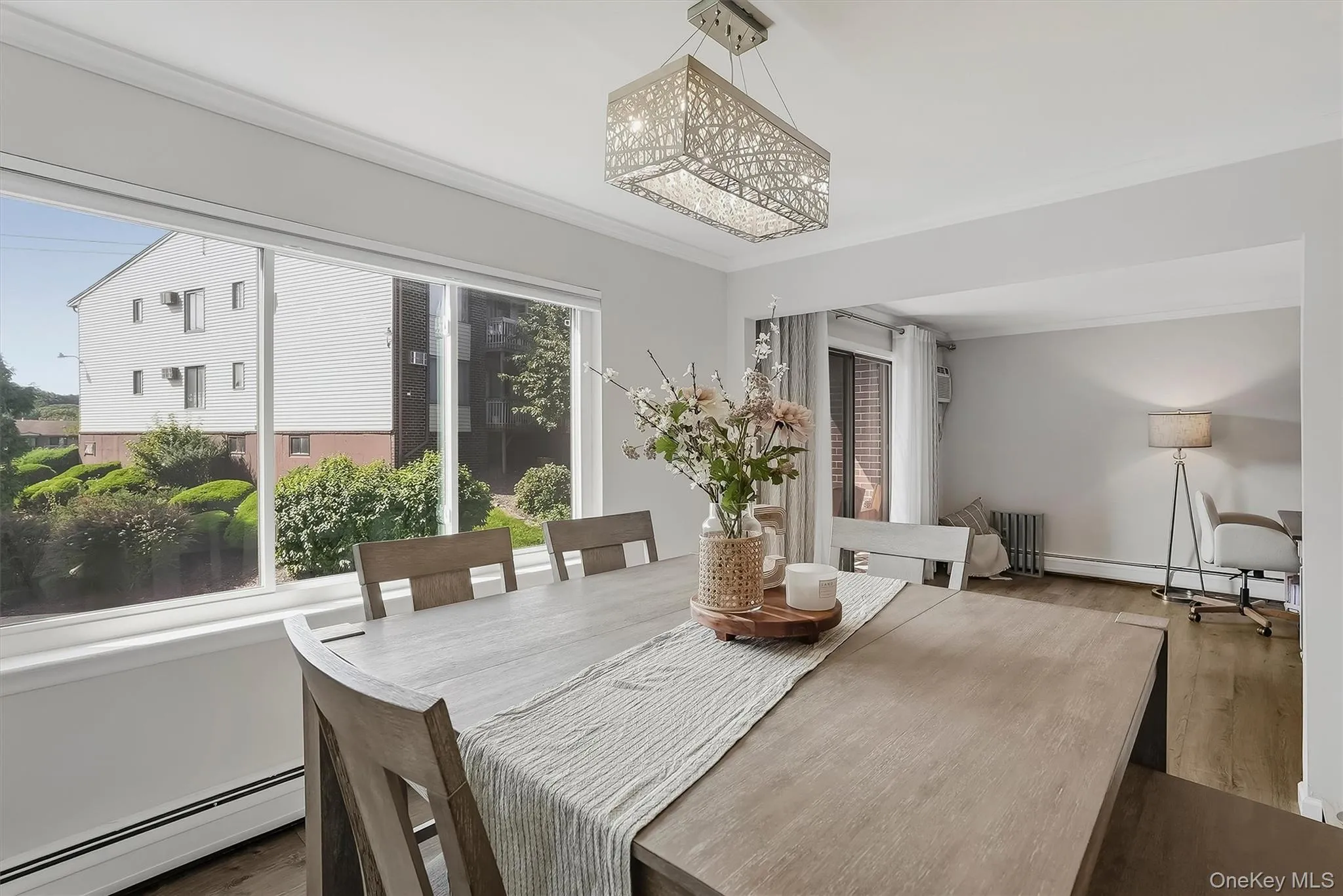 Dining area with great windows overlooking the landscaped grounds. Dining area with great windows overlooking the landscaped grounds.