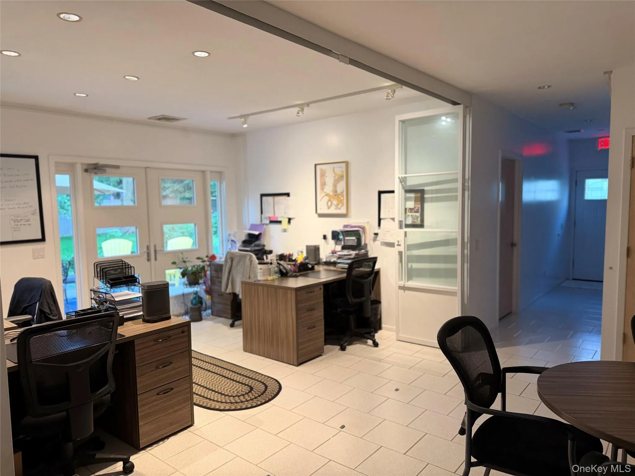 Admin area with access to back patio and side door. Admin area with access to back patio and side door.