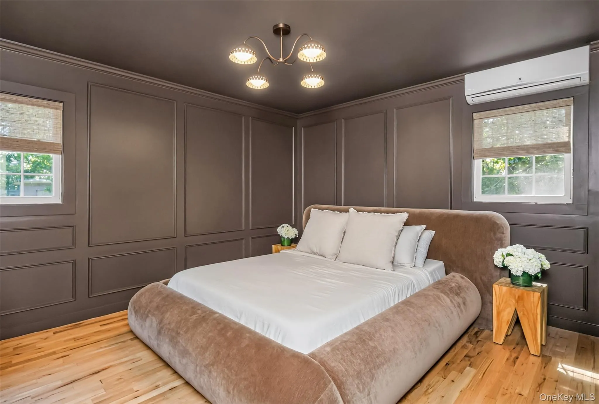 Wall-paneled luxury turns this primary suite into a true retreat. Wall-paneled luxury turns this primary suite into a true retreat.