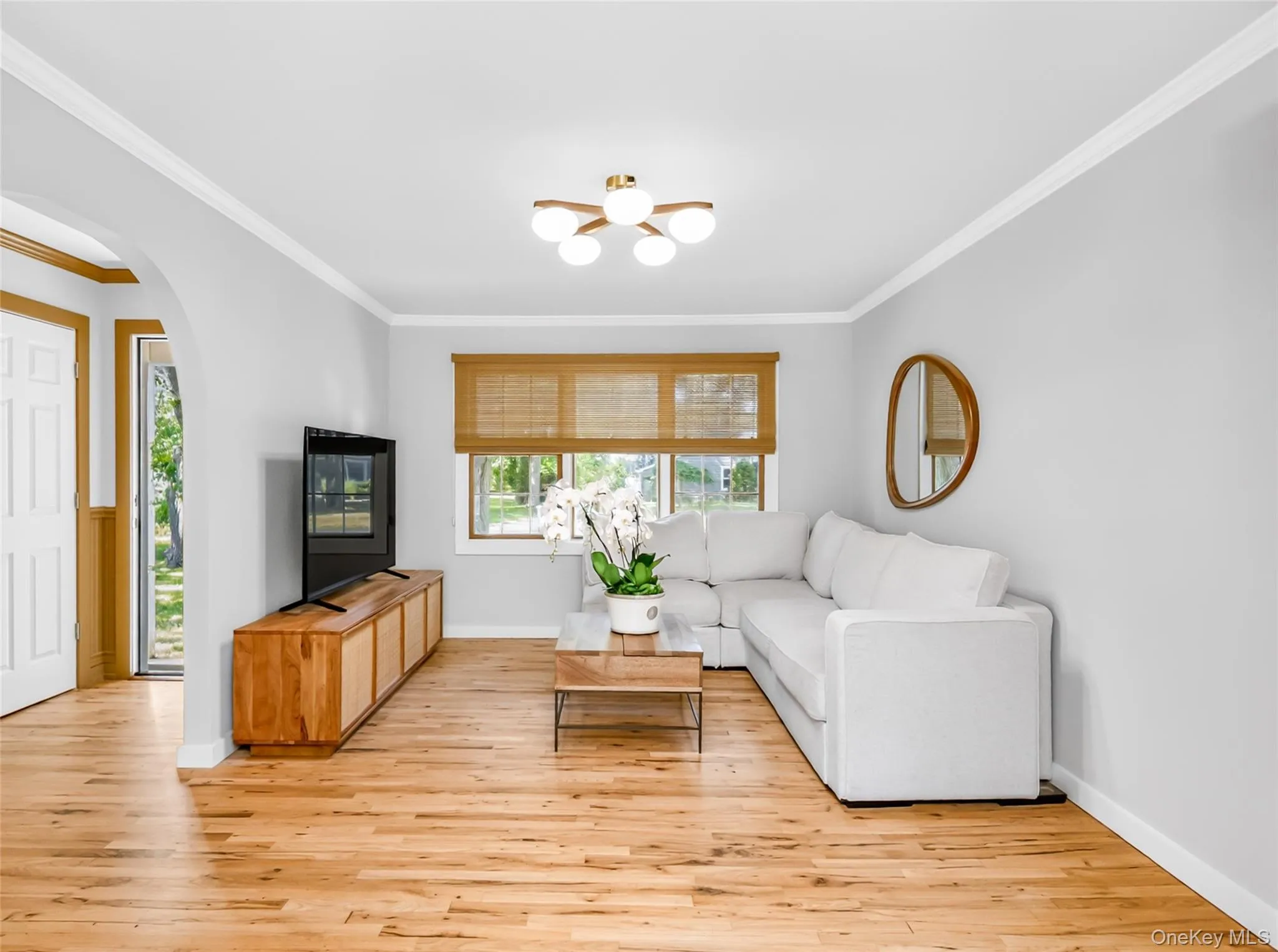 Bright, airy, and anchored by gleaming hardwoods—this living room is move-in-ready magic. Bright, airy, and anchored by gleaming hardwoods—this living room is move-in-ready magic.