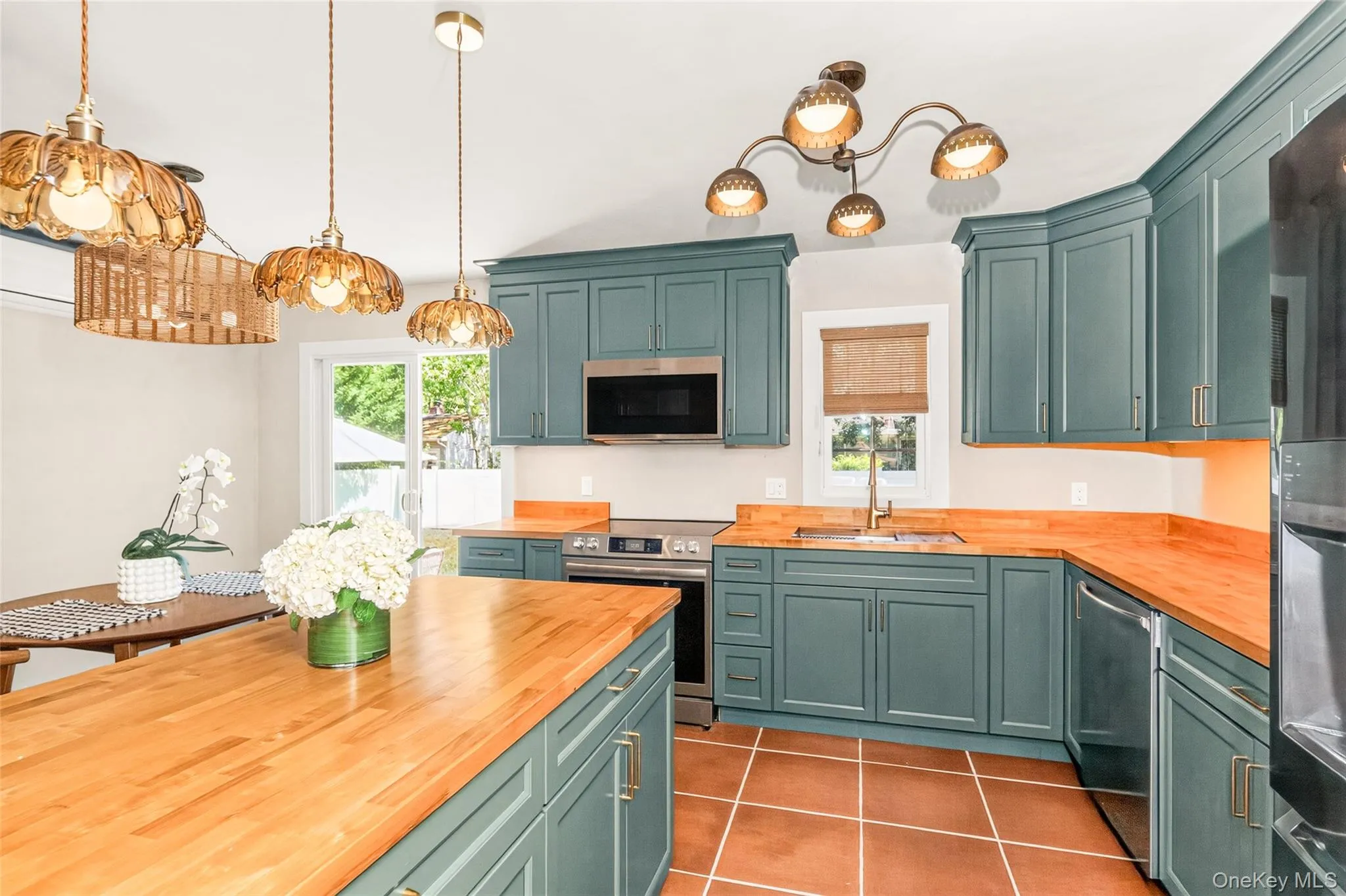 A fully renovated designer kitchen where vintage-inspired lighting meets modern function. A fully renovated designer kitchen where vintage-inspired lighting meets modern function.