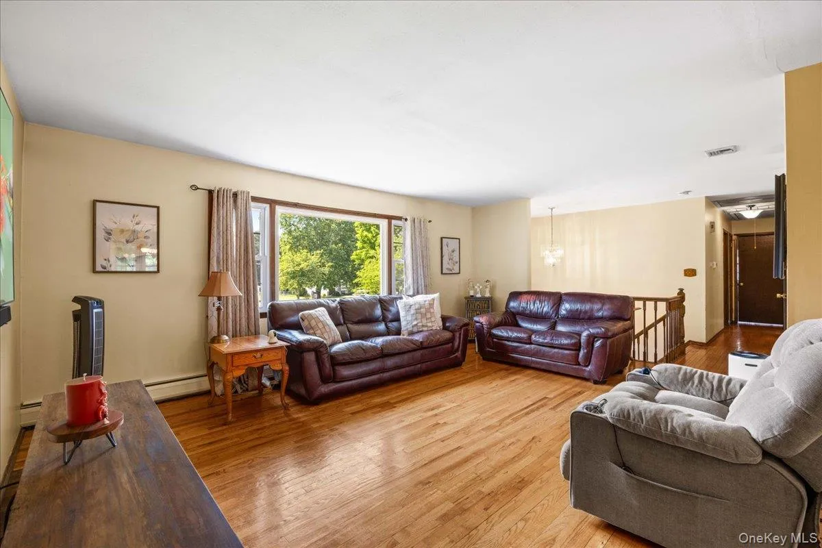 An abundance of natural light dances over the hardwood floors. An abundance of natural light dances over the hardwood floors.