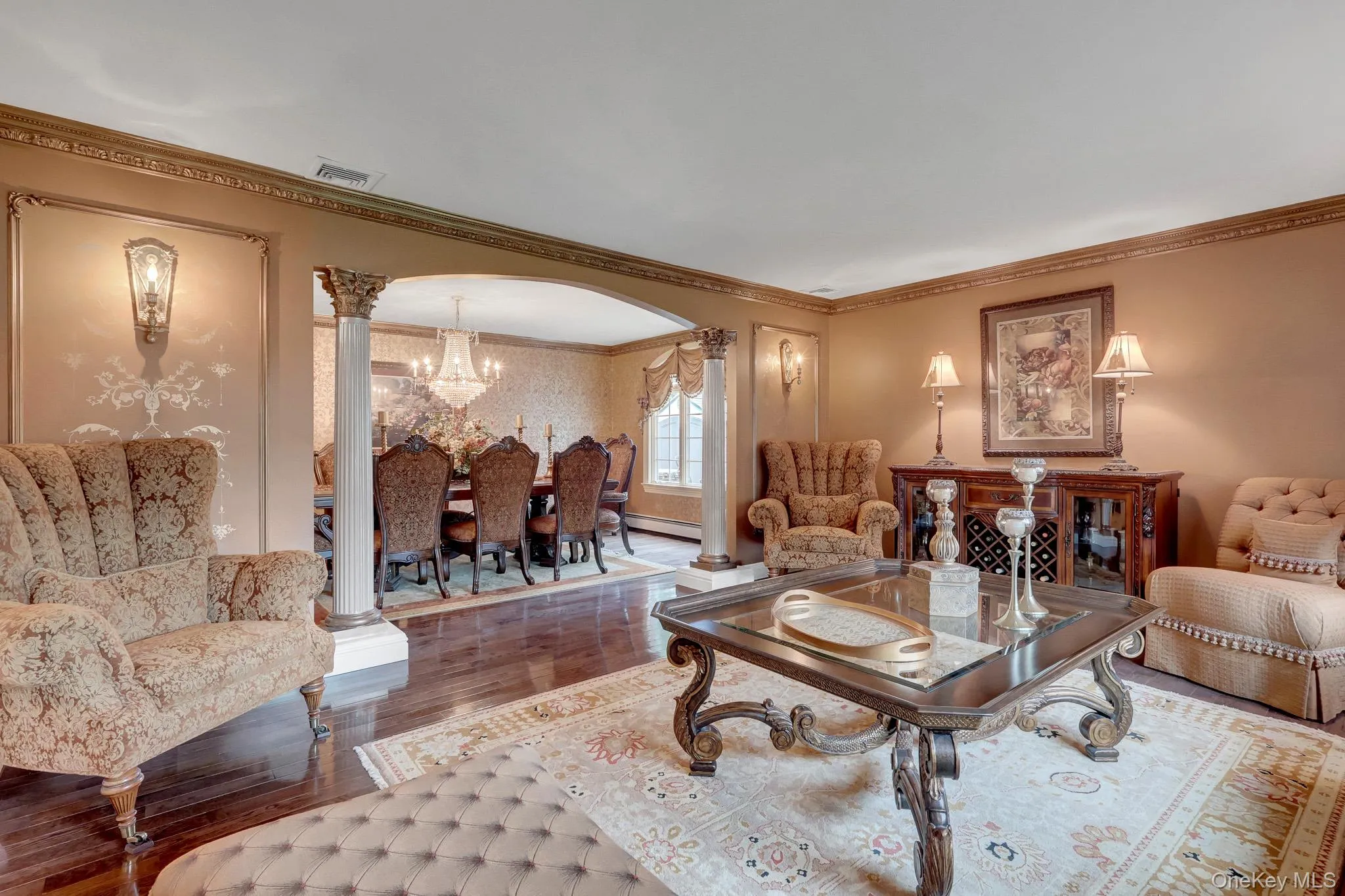 Archway entry featuring decorative columns and crown molding Archway entry featuring decorative columns and crown molding