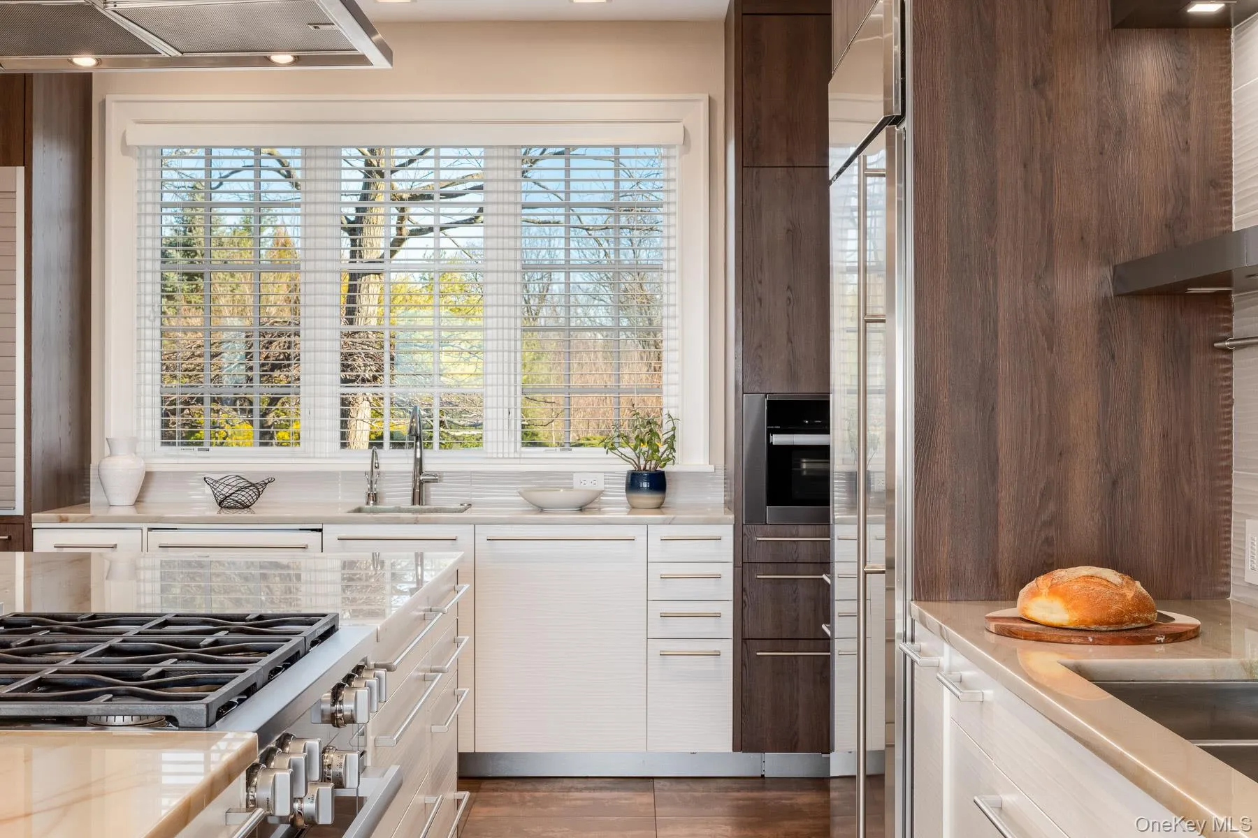The sunlit kitchen boasts every amenity including 3 sinks , 2 dishwashers and walk-in pantry. The sunlit kitchen boasts every amenity including 3 sinks , 2 dishwashers and walk-in pantry.