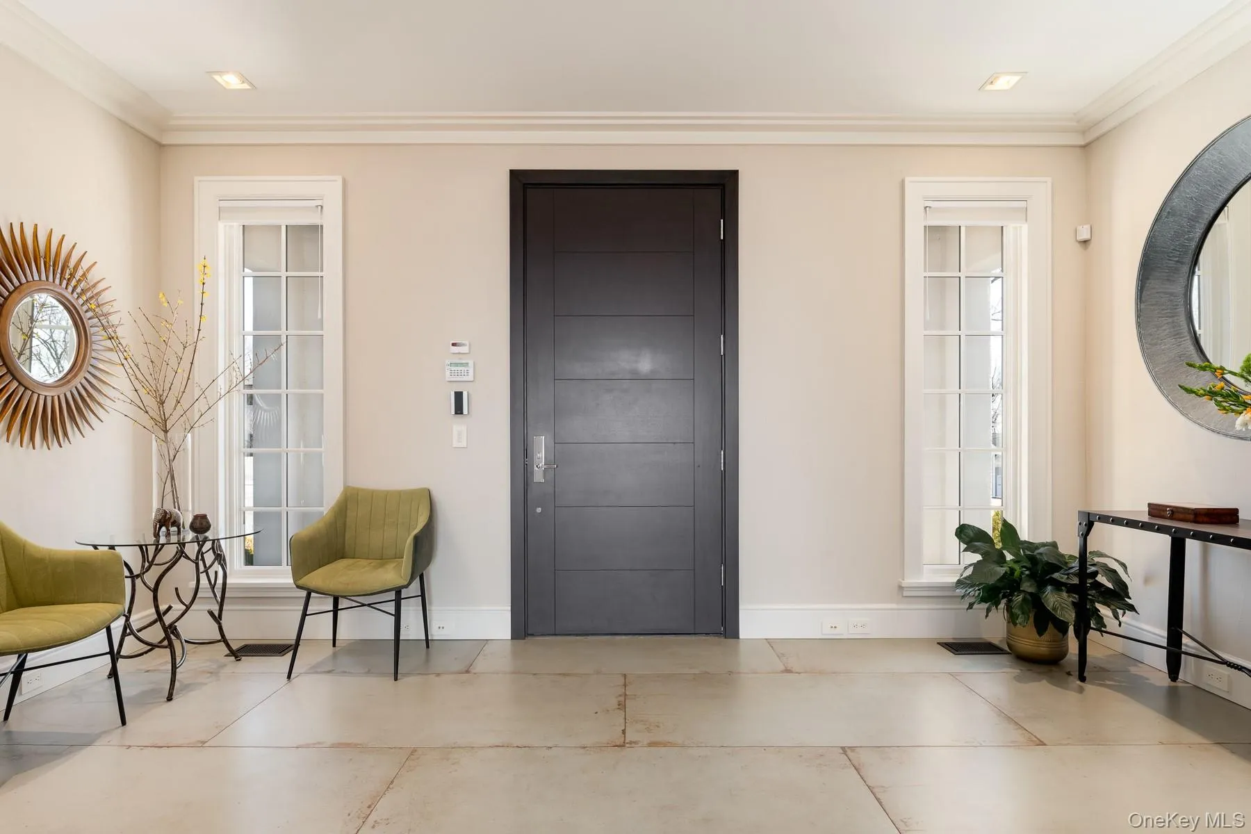 Elegant entry foyer enhanced with porcelain tile floors. Elegant entry foyer enhanced with porcelain tile floors.