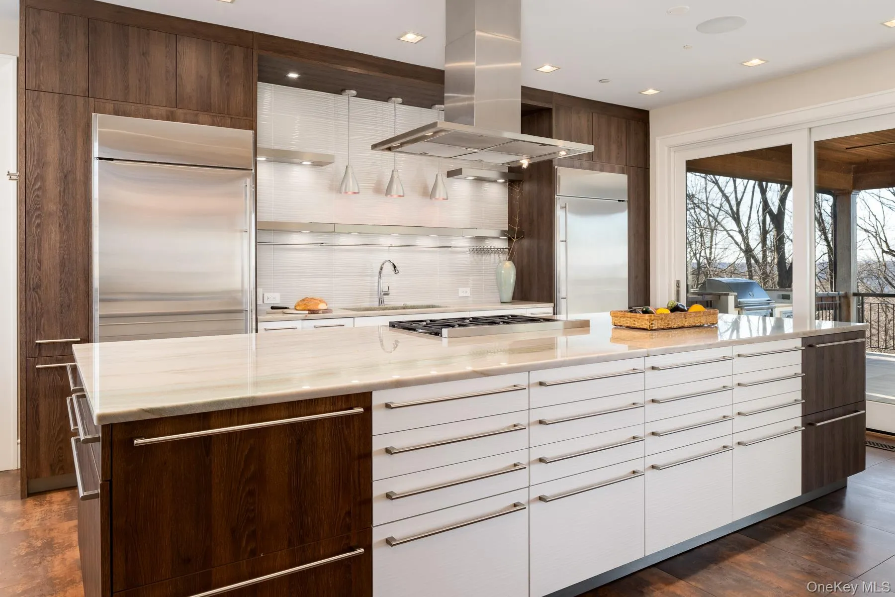 The gourmet kitchen, designed with European cabinetry and Quartzite countertops. The gourmet kitchen, designed with European cabinetry and Quartzite countertops.