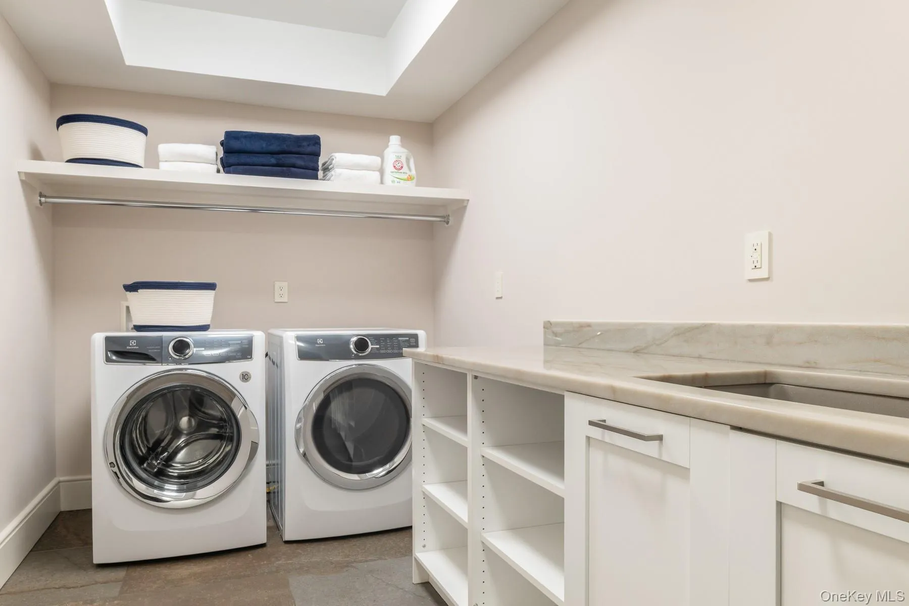 Spacious lower level laundry center. Spacious lower level laundry center.