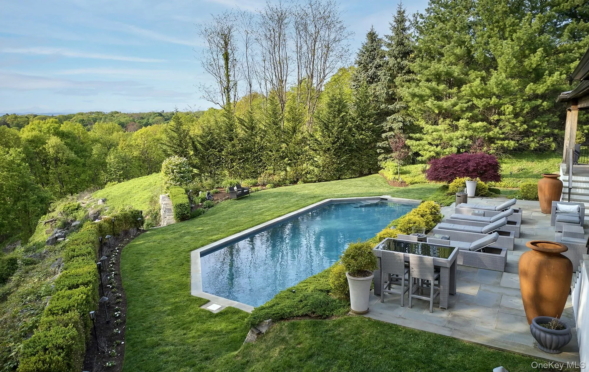 Rear landscaped garden with patio and salt water pool. Rear landscaped garden with patio and salt water pool.