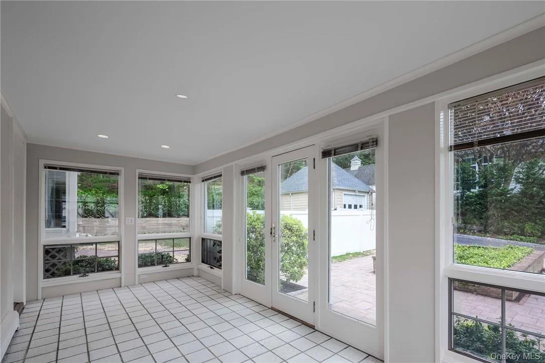 Glass enclosed Heated Porch with doors to Living Room and to the Outside Glass enclosed Heated Porch with doors to Living Room and to the Outside