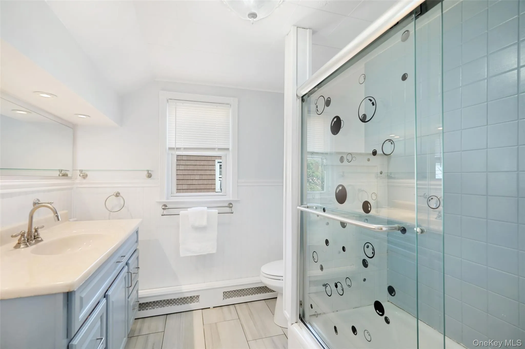 Full bathroom with vanity and linen closet Full bathroom with vanity and linen closet