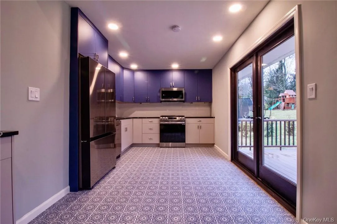 Kitchen with french doors to outside deck Kitchen with french doors to outside deck