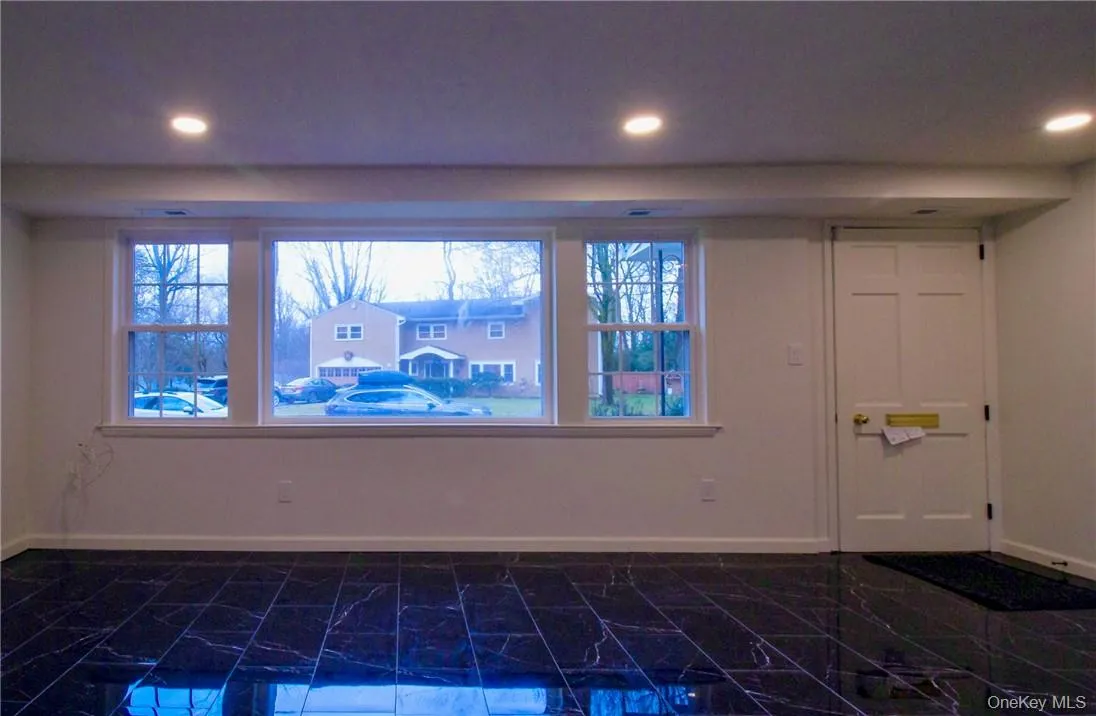 Living room. Picture done prior to blind installation. Living room. Picture done prior to blind installation.