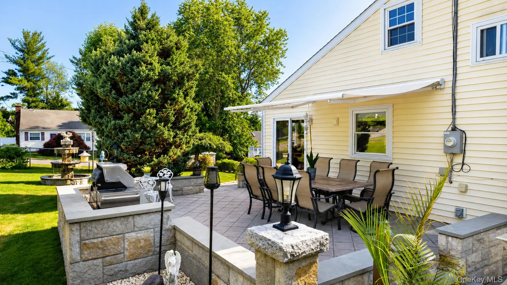 Side patio with built-in space for grilling is perfect for entertaining! Side patio with built-in space for grilling is perfect for entertaining!