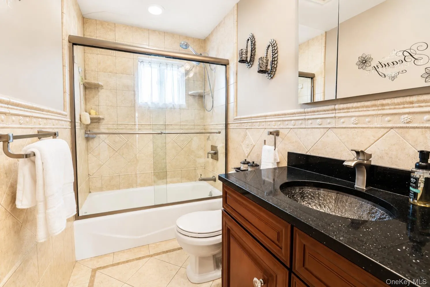 Full Hall Bath boasts tumbled marble accents and vanity Full Hall Bath boasts tumbled marble accents and vanity