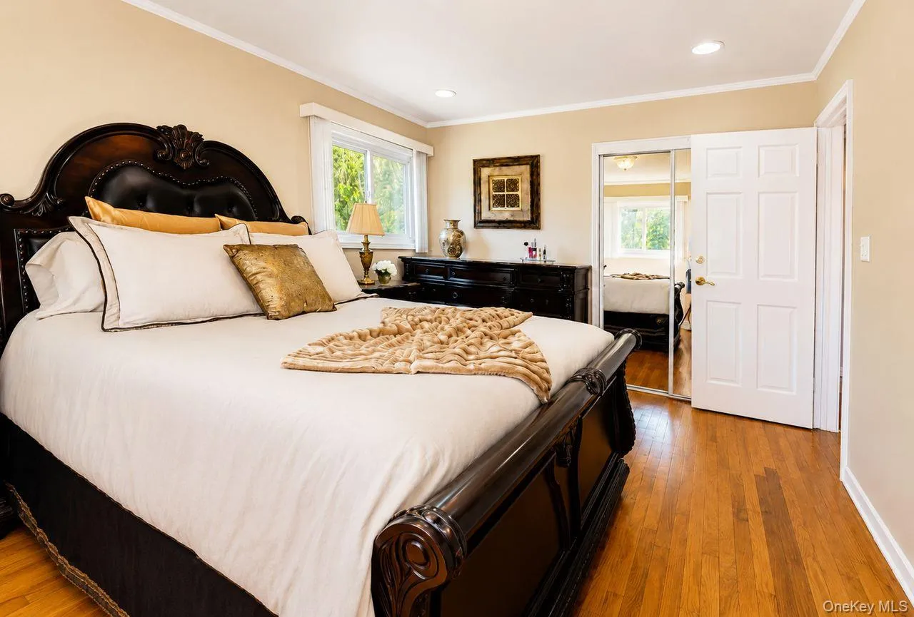 Largest bedroom with hardwood flooring and generous closet space Largest bedroom with hardwood flooring and generous closet space