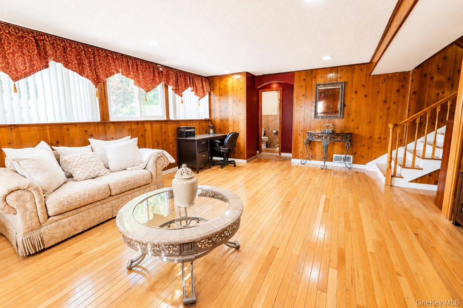 Recreation room boasts gleaming hardwood floors and recessed lighting Recreation room boasts gleaming hardwood floors and recessed lighting