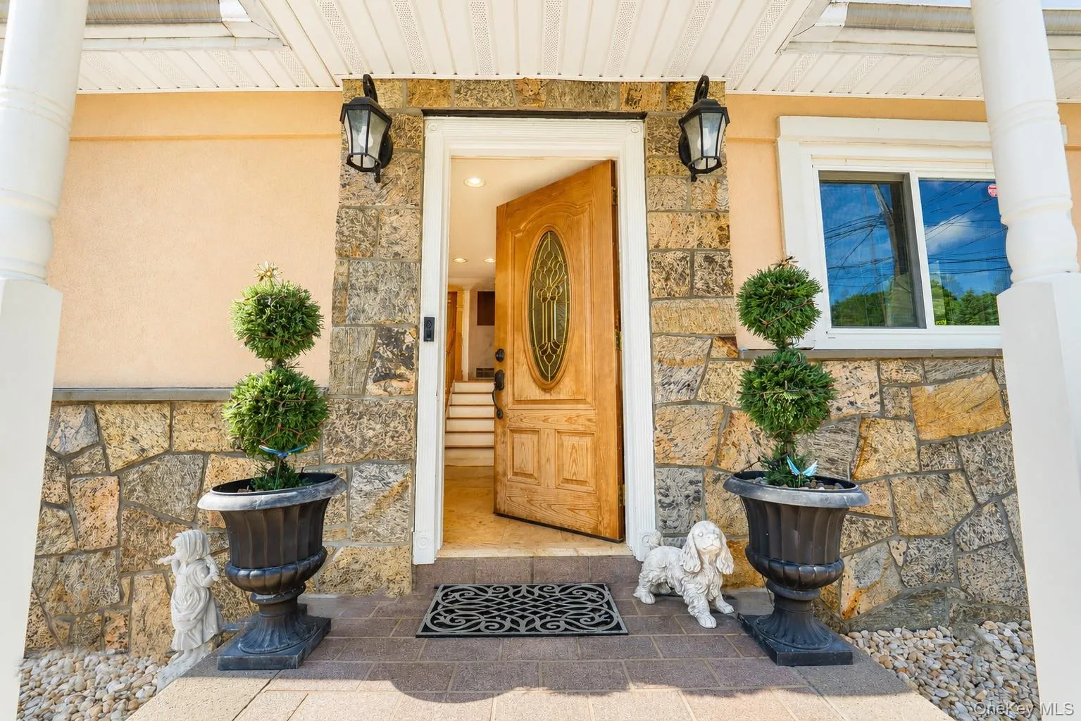 Entry depicts stone exterior trim Entry depicts stone exterior trim