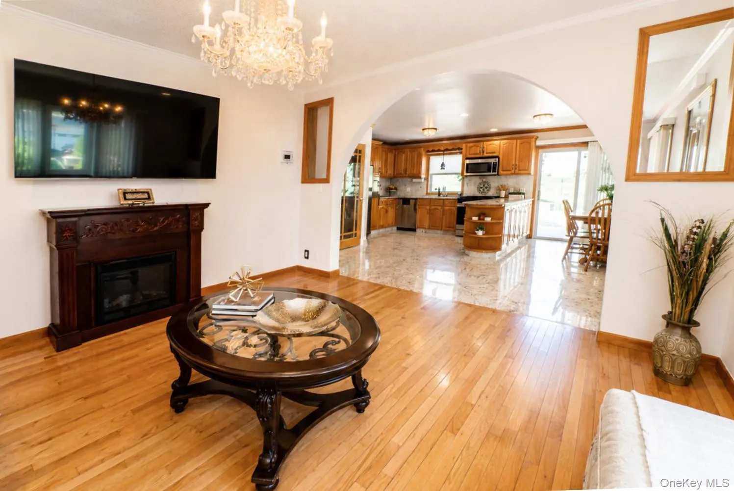 Living room features gleaming hardwood floors Living room features gleaming hardwood floors
