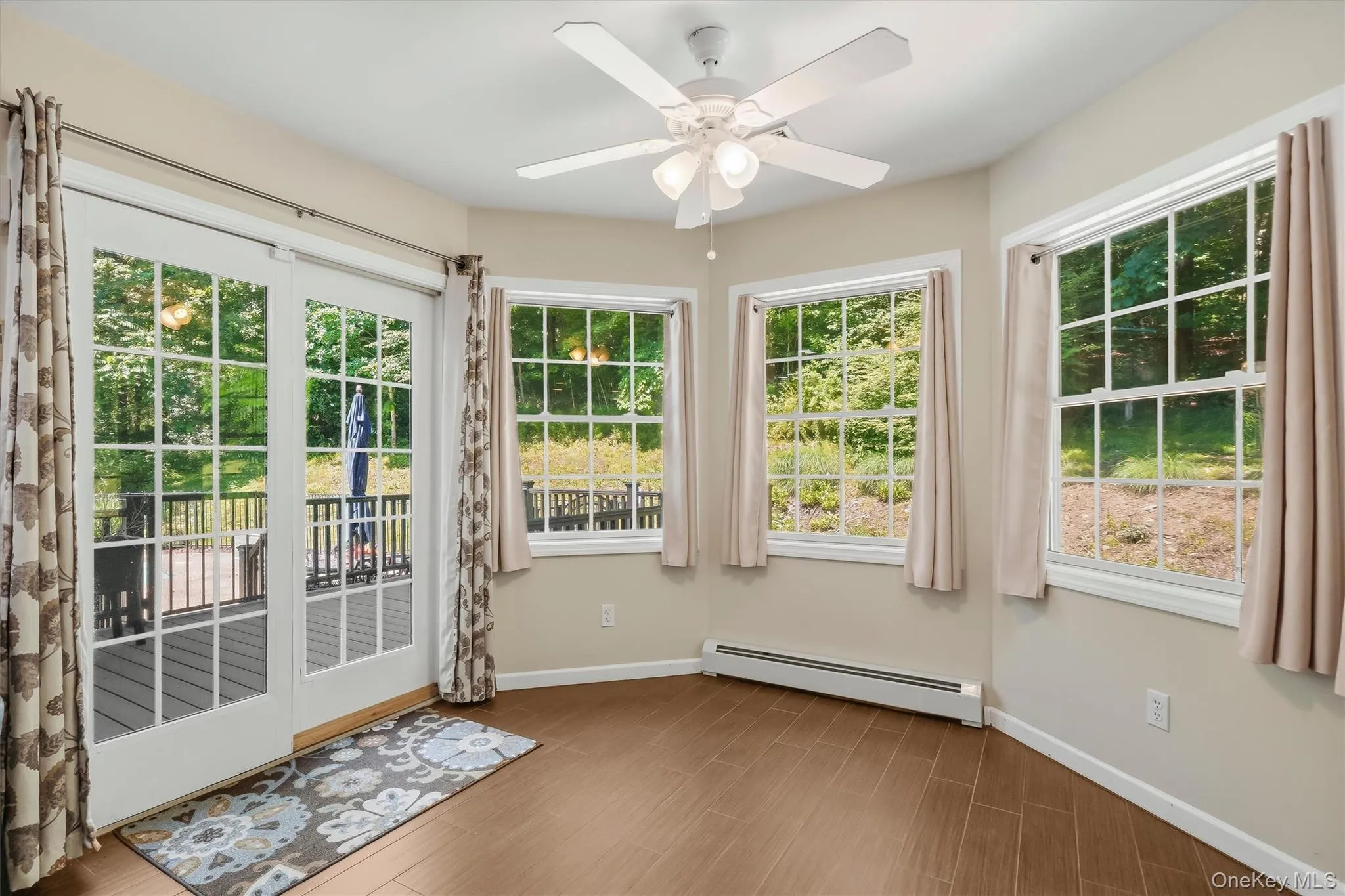 Cozy breakfast nook in kitchen with door leading to backyard deck Cozy breakfast nook in kitchen with door leading to backyard deck