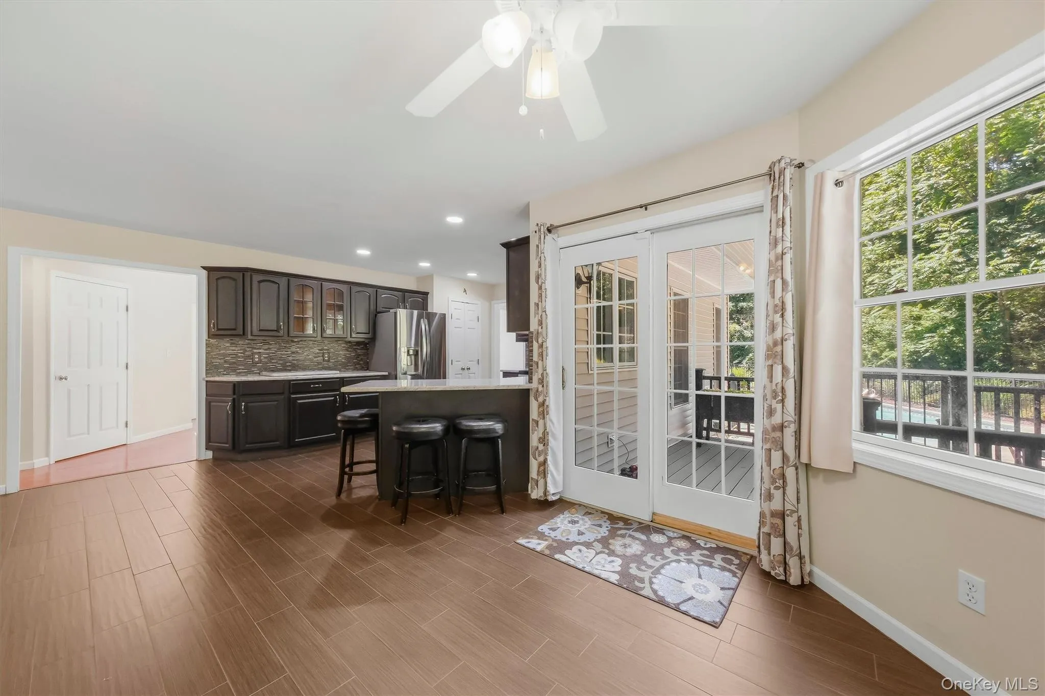Cozy breakfast nook in kitchen with door leading to backyard deck Cozy breakfast nook in kitchen with door leading to backyard deck
