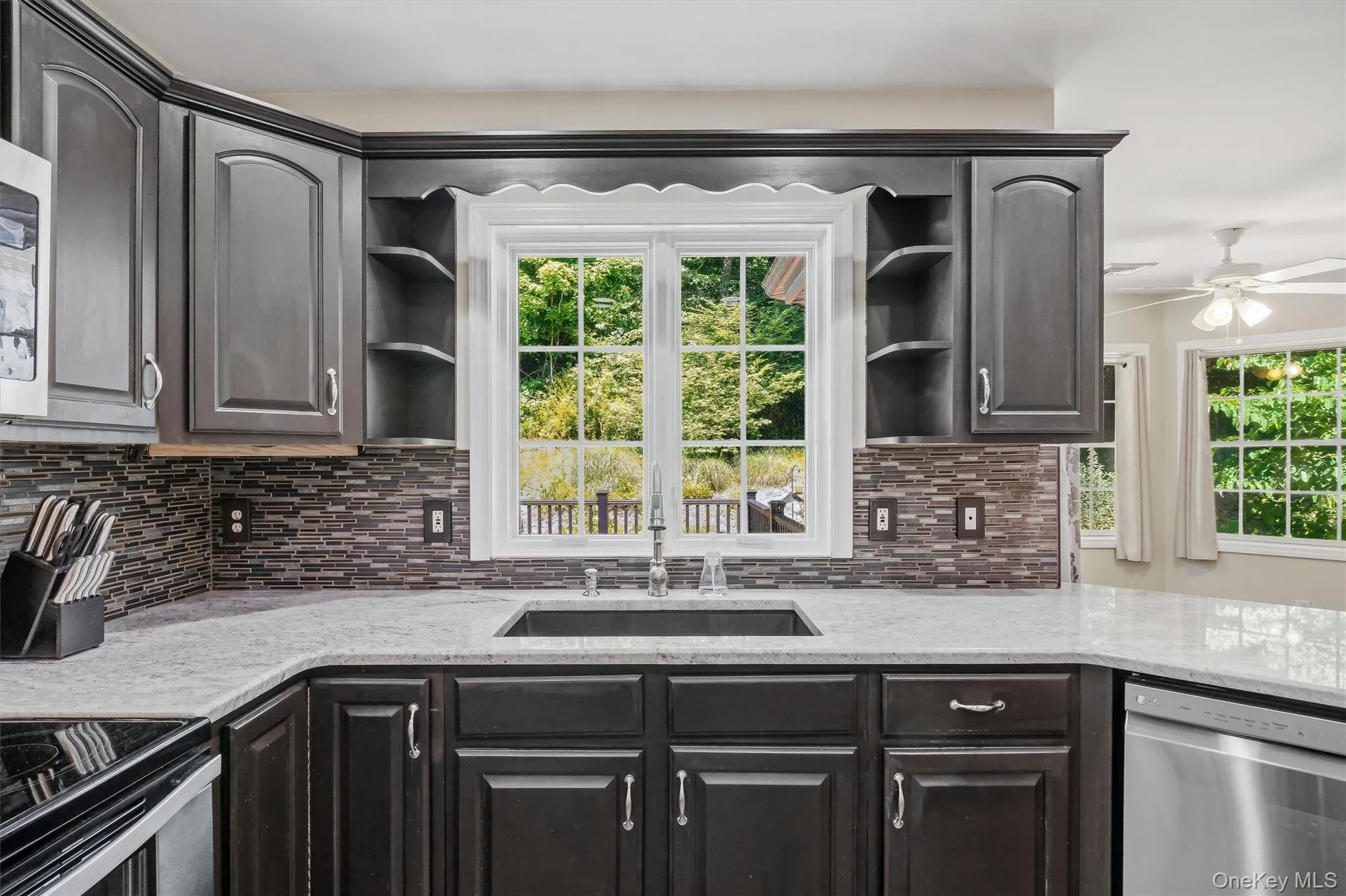 Chef's kitchen with granite countertops & stainless steel appliances Chef's kitchen with granite countertops & stainless steel appliances
