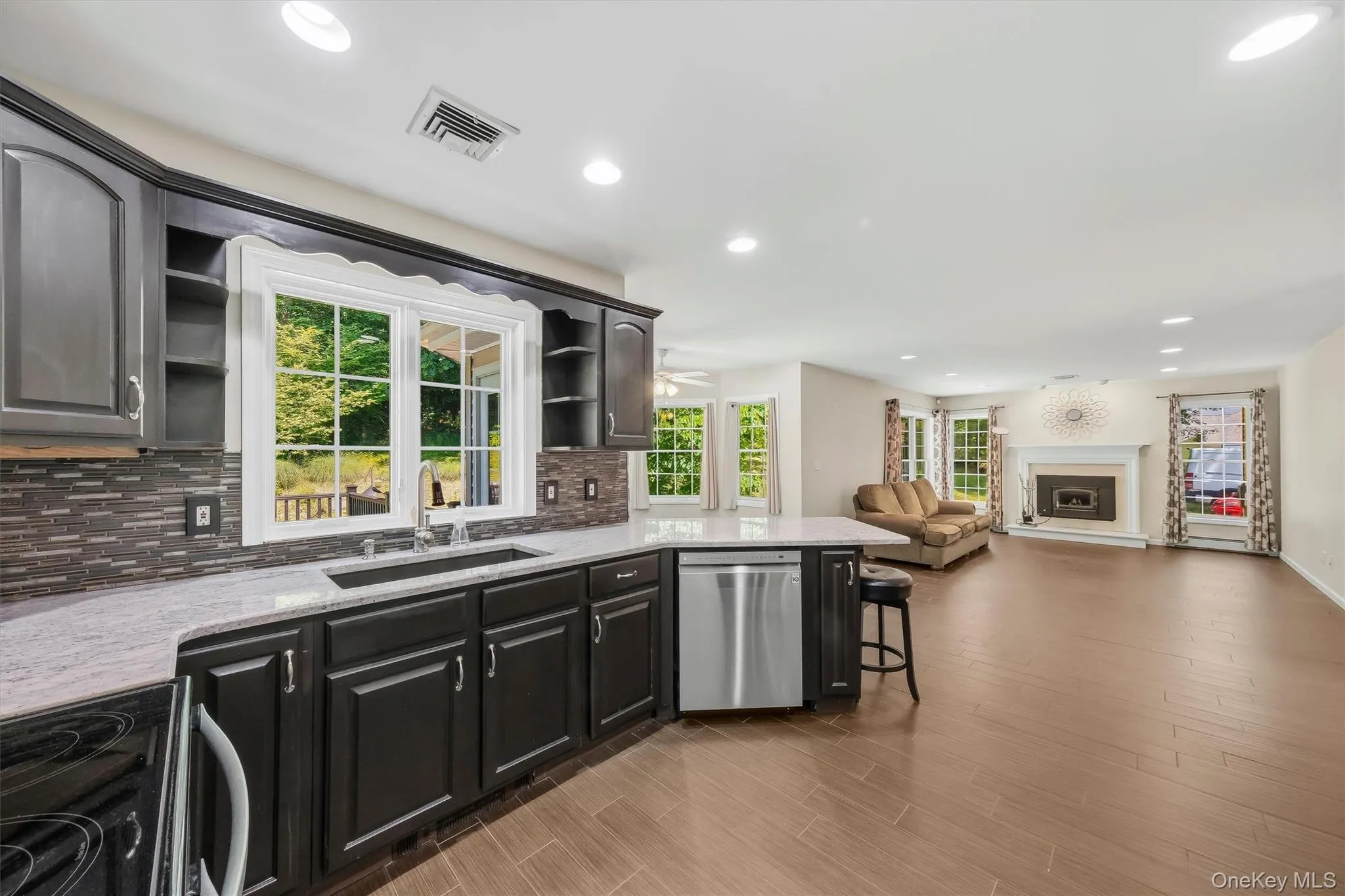 Chef's kitchen with granite countertops & stainless steel appliances Chef's kitchen with granite countertops & stainless steel appliances