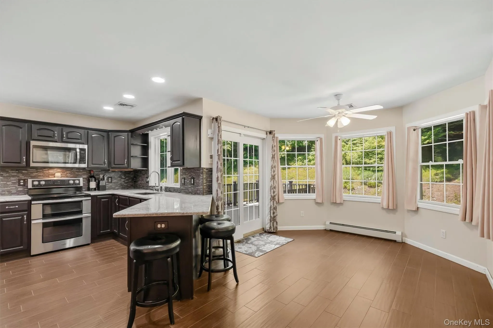 Chef's kitchen with granite countertops & stainless steel appliances Chef's kitchen with granite countertops & stainless steel appliances